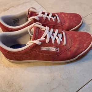 Reebok red tennis shoes with animal print